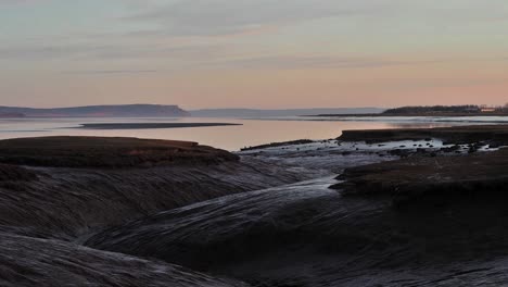 bay of fundy, nova scotia atlantic ocean rising tide shoreline during sunrise