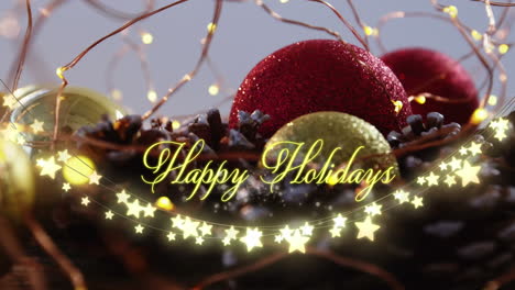 animation of text, happy holidays, in yellow, over string lights and christmas decorations