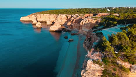 stunning aerial view of cliffs and beach along the coast of portugal