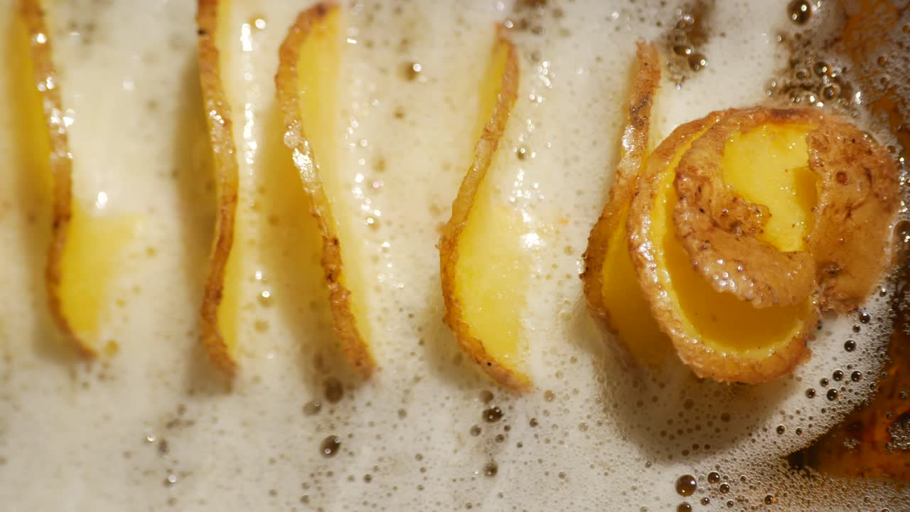 Potato Slices Deep Frying in Hot Oil