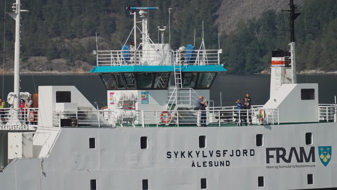 Passengers on the deck of the Sykkylvsfjord ferry