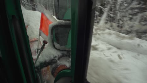 close up of snow plow clear snowy road