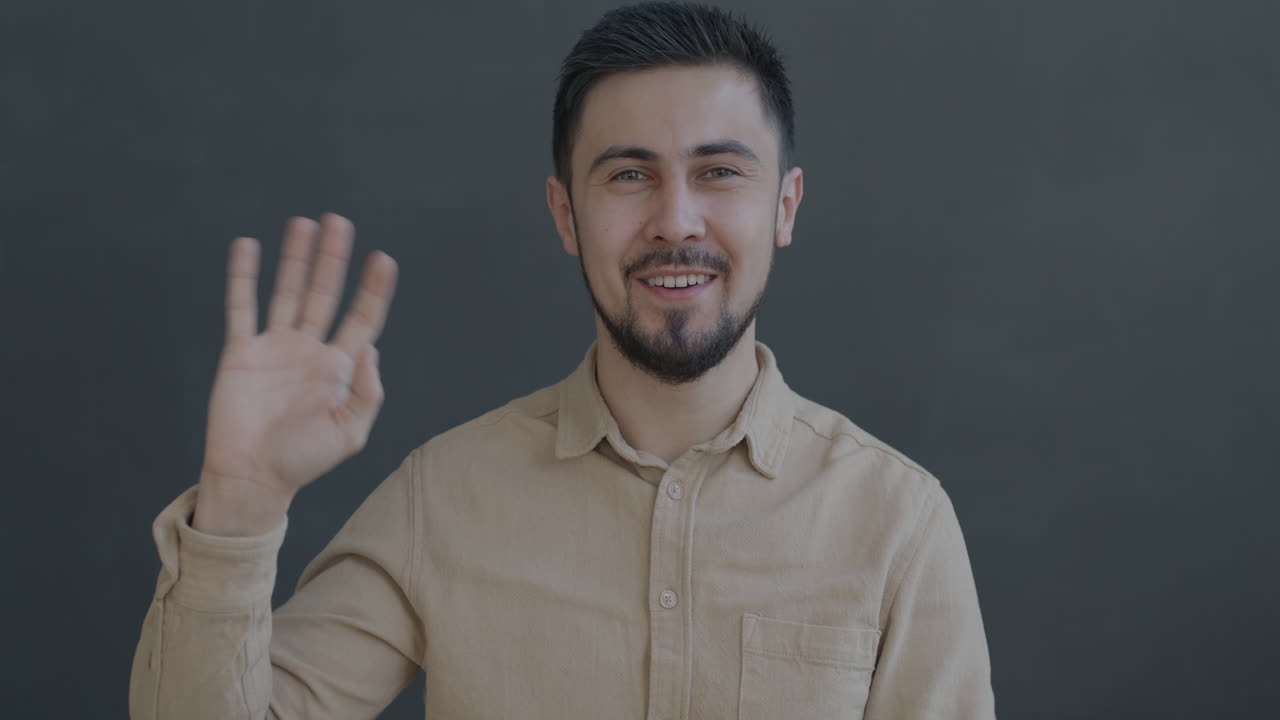 Man Smiling and Greeting