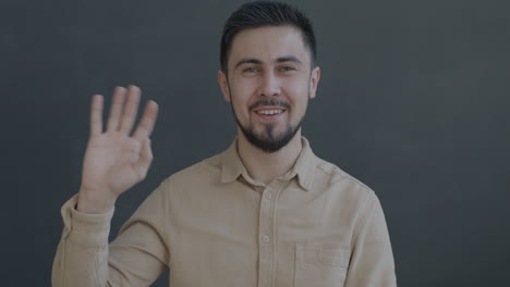 man smiling and greeting