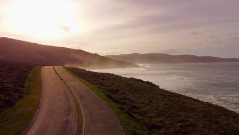 aerial view of scenic coastal highway at sunset