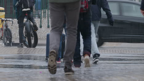 pedestrians crossing busy intersection