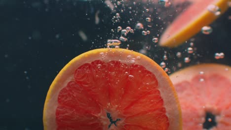 grapefruit under water with air bubbles and in slow motion. fresh and juicy healthy vegetarian.