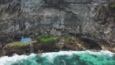 peguyangan waterfall at base of pura segara kidul