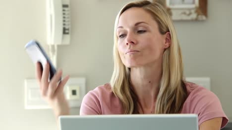 Frustrated-woman-shaking-her-head-while-she-is-on-the-phone