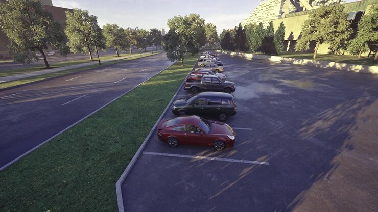 Zona de estacionamiento suburbana con parabrisas relucientes y medianas verdes.