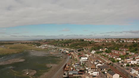 Rising-shot-over-coastal-fishing-village-over-marshes