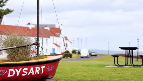 red boat in scenic coastal town