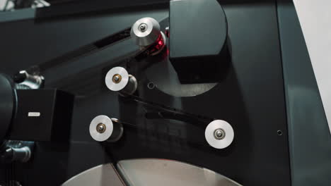 16-mm-film-loaded-on-rolls-in-a-screening-machine
