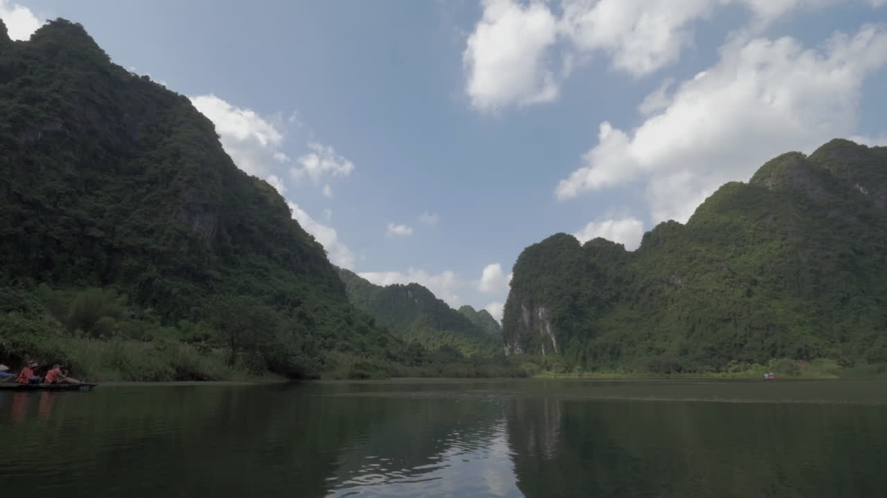 Tourists traveling by boats to see the landscapes of Trang An Vietnam