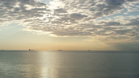 beautiful sea horizon sky shining sunset clouds in majestic nature background.