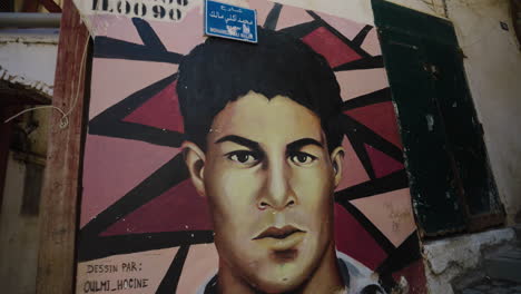 artistic male portrait painted on the wall of casbah of algiers in algeria