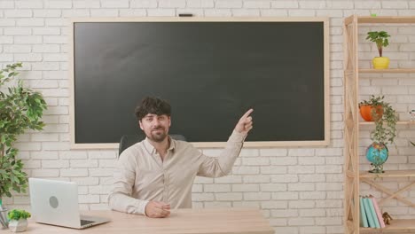 teacher in classroom pointing