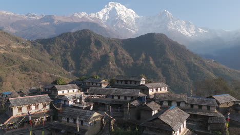 aerial drone shot of traditional nepali homes in ghandruk village, kaski, nepal