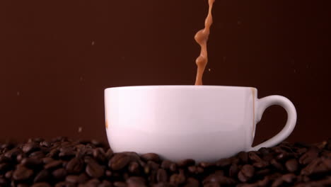 Sugar-pouring-into-white-coffee-cup