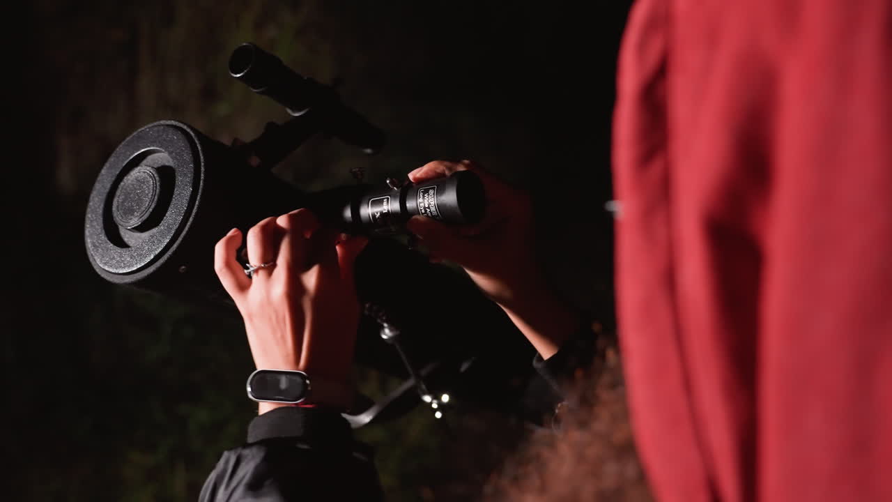 night sky telescope adjustment by astronomer, hands finetuning eyepiece on tripod in quiet backyard, glasses reflecting faint starlight, focused alignment for astrophotography and star observation