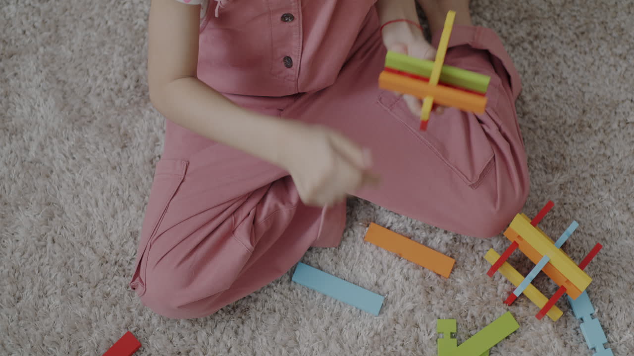 Girl Playing with Wooden Blocks