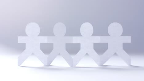 primer plano de personas con las manos hechas de papel blanco sobre un fondo blanco con espacio de copia