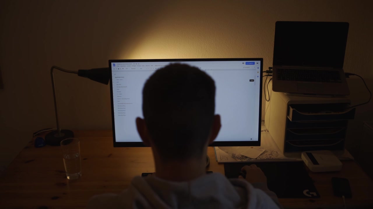 Man works at the computer at night.