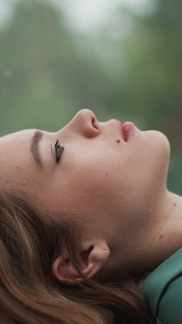 exhausted woman slumped near window. incessant overwork in office evident in weary lines etched on face. woman drained from ceaseless demands