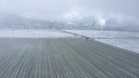 flying through a snowstorm over a wintery, snowy farm in tehachapi, ca