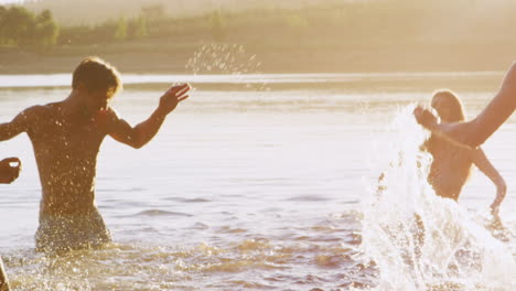 Adult-friends-having-fun-in-a-lake,-close-up-panning-shot