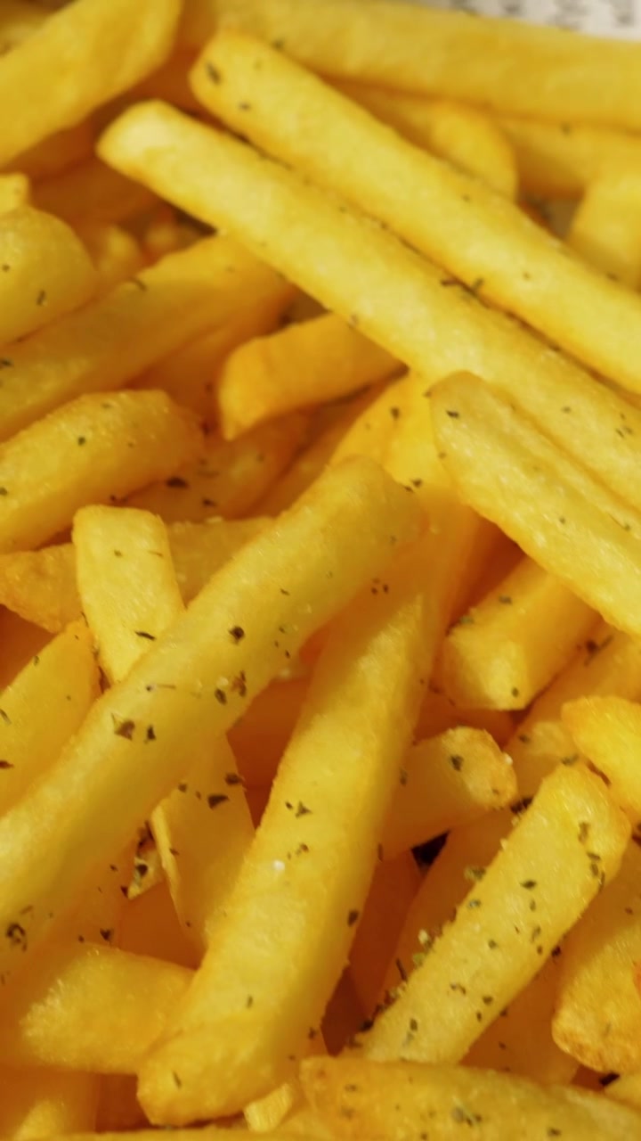 Eating appetizing crunchy French fries