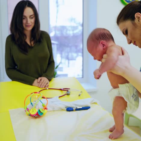 child patient visiting doctor office. caring doctor examining little children in the office