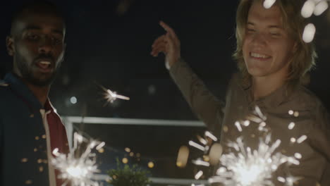 Friends Celebrating with Sparkler at Rooftop