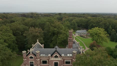 drone flying backwards and reveal schaffelaar castle in barneveld, the netherlands