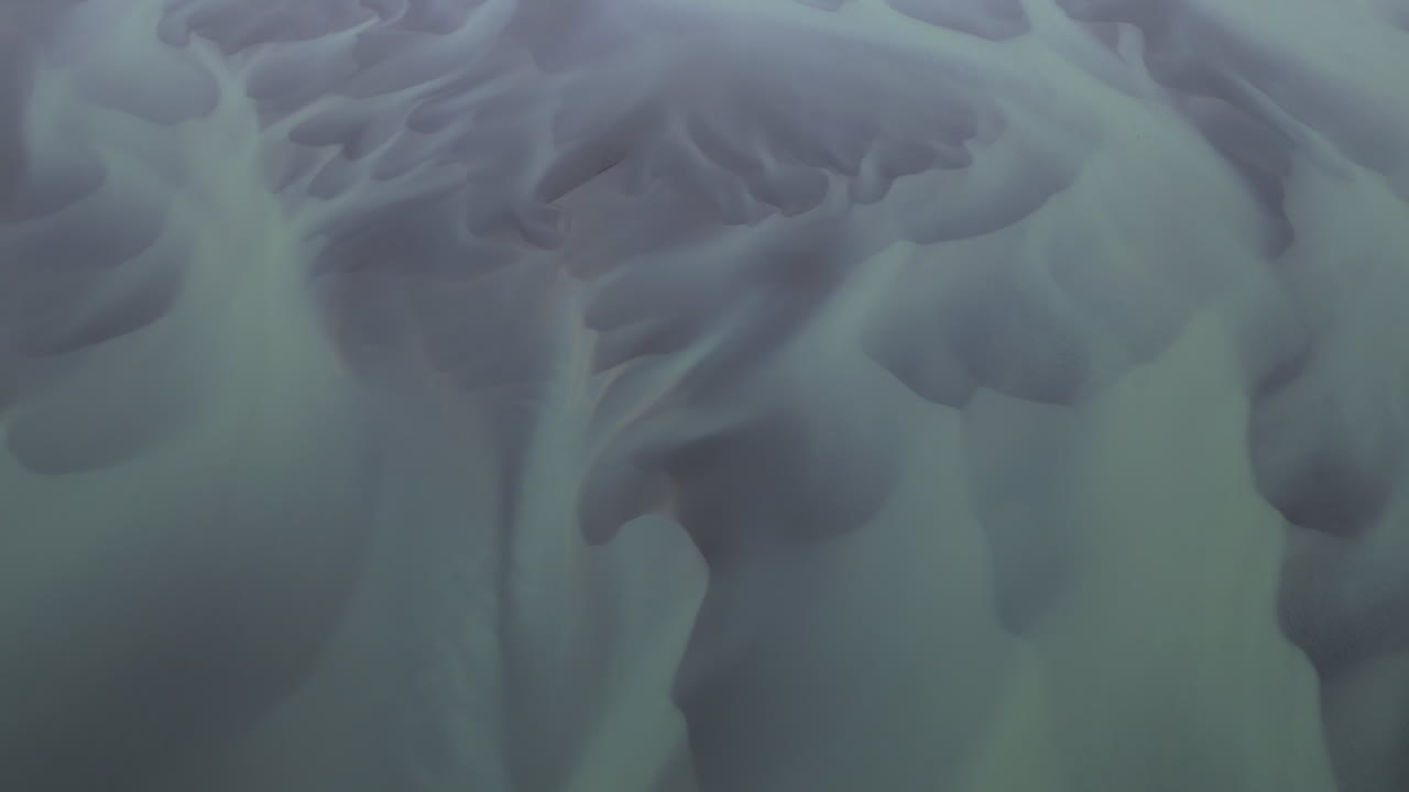 Abstract aerial view of braided Glacial River channels creating organic greenish patterns, Iceland