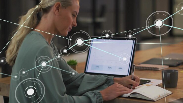Woman leaning writing notebook, tablet gauge sparking nodes sweeping around her for business