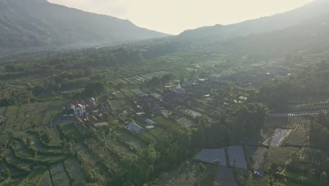 magical aerial view of rural landscape with sun rays of morning sun