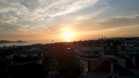 the sun setting slowly over the ocean on a calm day in lisbon, portugal