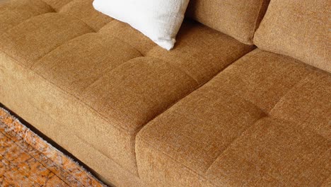 close-up of a brown sofa with cushions