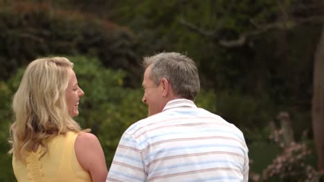 mature happy couple sitting talking