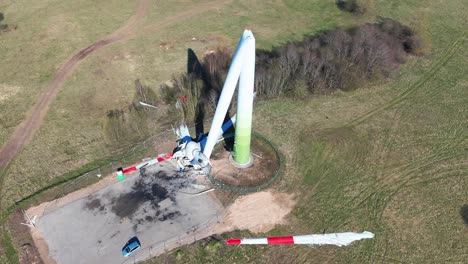 Drone-shot-of-broken-wind-turbine-on-a-sunny-day-in-Taurage,-Lithuania