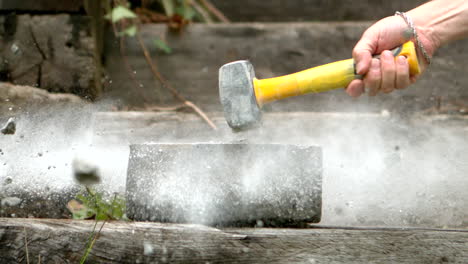 Sledge-hammer-smashing-a-concrete-block