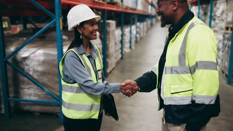 warehouse workers shaking hands