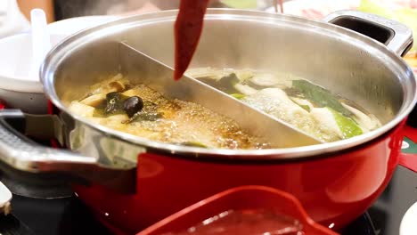 cooking hotpot with fresh ingredients in bangkok