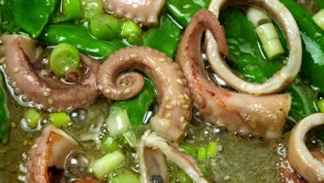 close up topdown shot of a stir fry sizzling in a frying pan