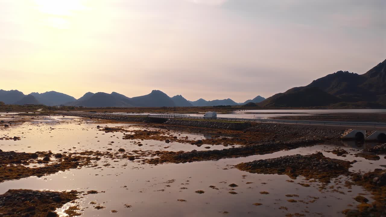 Golden hour shot of Vestarelen, Norway, showcasing beautiful reflections in calm waters