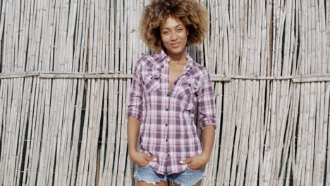 adorable woman posing against wall