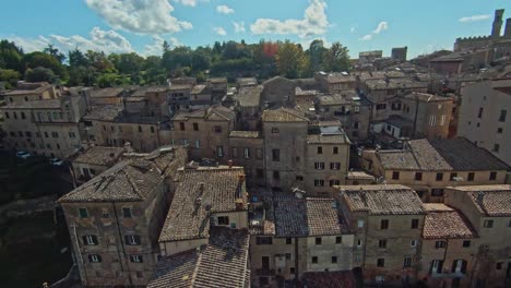 Fast-aerial-over-the-walled-town-of-Volterra,-Province-of-Pisa,-Italy