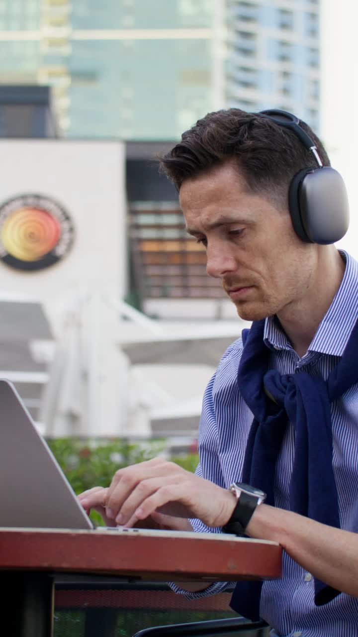 Businessman Working Outdoors with Laptop