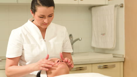 facial treatment with a massage at beauty spa